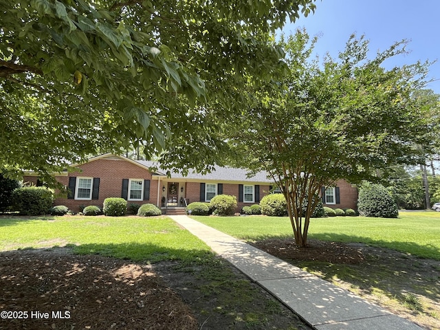 1215 Dunbar Dr, Laurinburg, NC 28352 - ranch-style home featuring brick siding and a front yard
