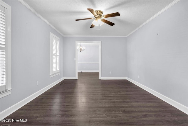 1012 Greenway Rd, Jacksonville, NC 28546 - spare room featuring healthy amount of natural light, ceiling fan, dark wood-style flooring, ornamental molding, and baseboards