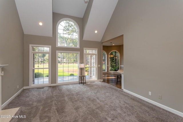 24 Mcnish Rd, Southern Pines, NC 28387 - unfurnished living room featuring high vaulted ceiling, carpet, baseboards, and recessed lighting