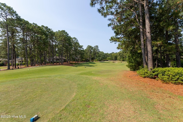 24 Mcnish Rd, Southern Pines, NC 28387 - view of home's community featuring golf course view, a lawn, and view of scattered trees