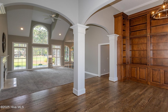 24 Mcnish Rd, Southern Pines, NC 28387 - foyer featuring arched walkways, decorative columns, a ceiling fan, dark wood-style flooring, and baseboards