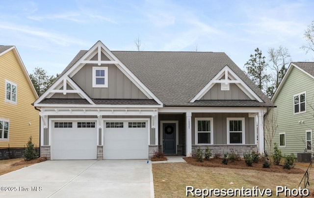 815 Weston Ln SE Unit 76, Bolivia, NC 28422 - craftsman-style home featuring board and batten siding, roof with shingles, concrete driveway, and stone siding