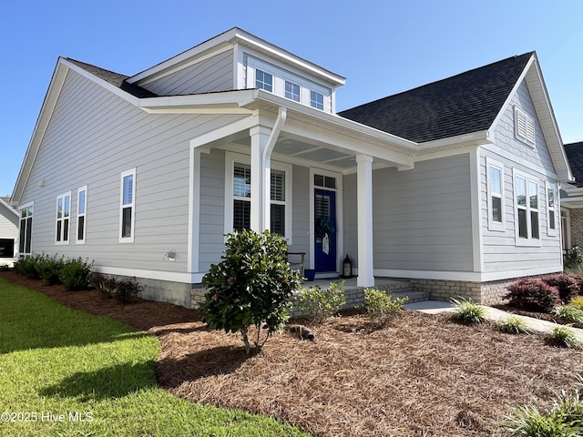4073 Reunion Pointe Ln, New Bern, NC 28562 - view of front of house with covered porch and a shingled roof