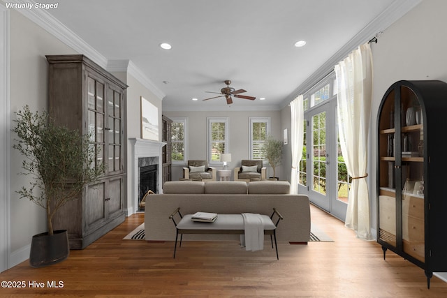 30 Deacon Palmer Pl, Southern Pines, NC 28387 - living room with recessed lighting, light wood-style floors, ceiling fan, a high end fireplace, and crown molding
