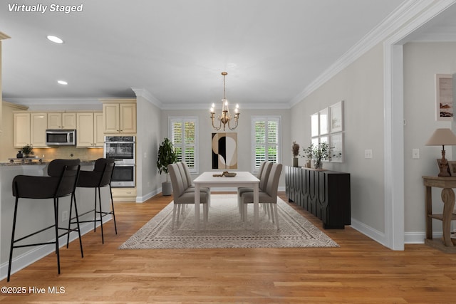 30 Deacon Palmer Pl, Southern Pines, NC 28387 - dining space featuring a chandelier, crown molding, light wood-style flooring, and recessed lighting