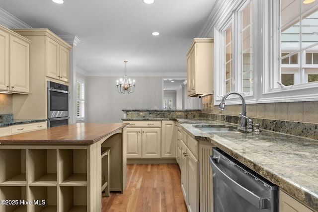 30 Deacon Palmer Pl, Southern Pines, NC 28387 - kitchen featuring appliances with stainless steel finishes, butcher block counters, light wood-style flooring, tasteful backsplash, and recessed lighting