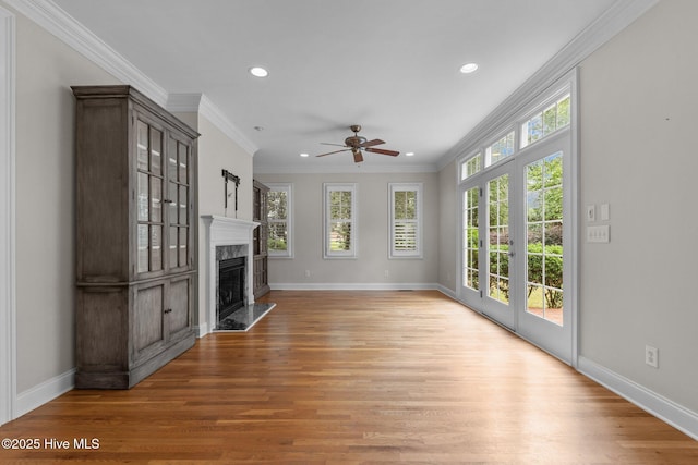 30 Deacon Palmer Pl, Southern Pines, NC 28387 - unfurnished living room with recessed lighting, light wood-type flooring, a ceiling fan, a fireplace, and ornamental molding