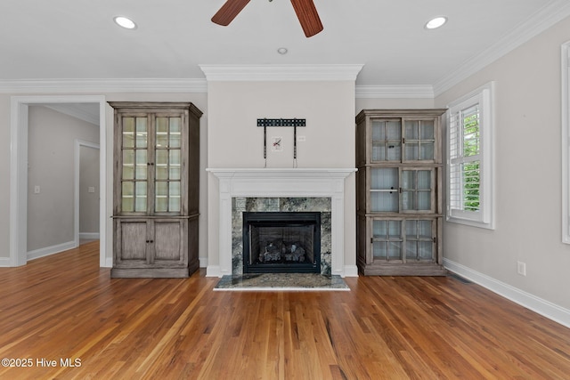30 Deacon Palmer Pl, Southern Pines, NC 28387 - unfurnished living room with ceiling fan, wood finished floors, a fireplace, crown molding, and recessed lighting