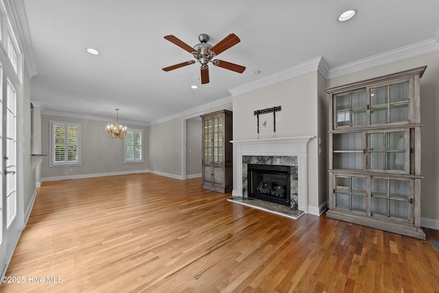 30 Deacon Palmer Pl, Southern Pines, NC 28387 - unfurnished living room with a fireplace, ceiling fan, a chandelier, light wood-type flooring, and crown molding