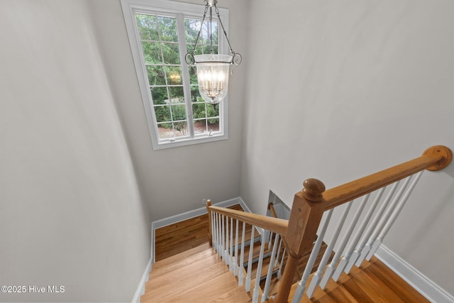 30 Deacon Palmer Pl, Southern Pines, NC 28387 - staircase with a chandelier, plenty of natural light, and wood finished floors