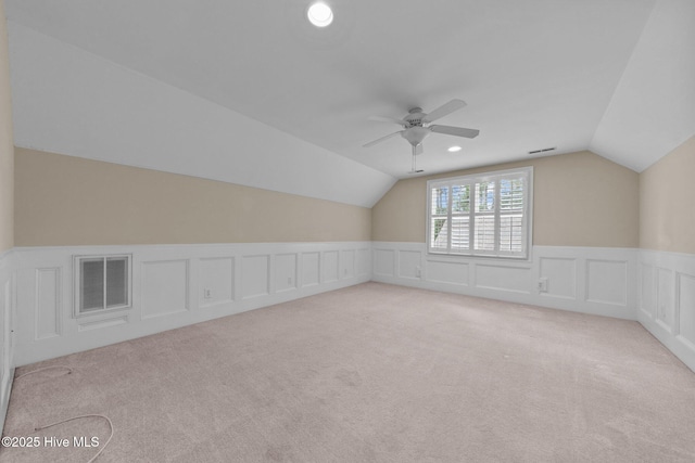 30 Deacon Palmer Pl, Southern Pines, NC 28387 - additional living space with lofted ceiling, ceiling fan, a wainscoted wall, carpet floors, and a decorative wall