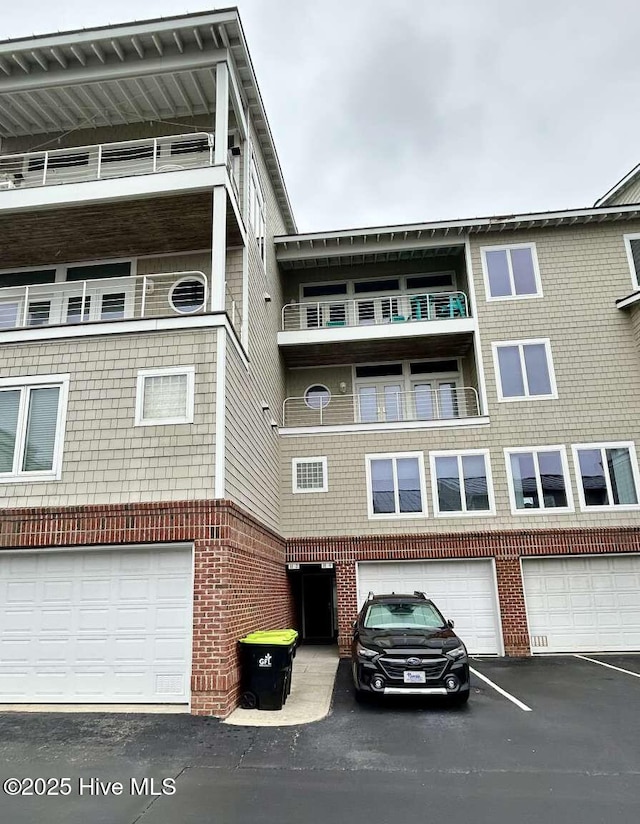 104 S 3rd St Unit H2, Morehead City, NC 28557 - view of building exterior featuring a garage and driveway