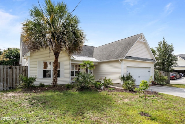 8122 Bahia Honda Dr, Wilmington, NC 28412 - view of front of property featuring a garage, concrete driveway, and roof with shingles