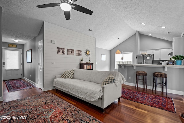 8122 Bahia Honda Dr, Wilmington, NC 28412 - living room featuring a textured ceiling, dark wood-style floors, a ceiling fan, baseboards, and recessed lighting
