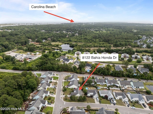 8122 Bahia Honda Dr, Wilmington, NC 28412 - aerial view of property and surrounding area featuring nearby suburban area and a heavily wooded area