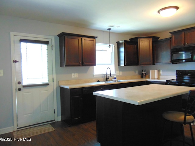205 Brice Ct, Hubert, NC 28539 - kitchen featuring black appliances, a sink, light countertops, and dark wood finished floors