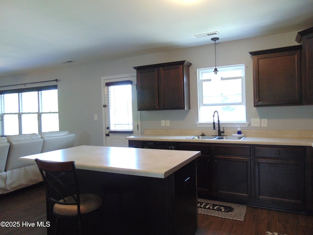 205 Brice Ct, Hubert, NC 28539 - kitchen featuring a sink, a center island, dark wood finished floors, and healthy amount of natural light