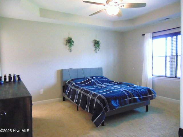 205 Brice Ct, Hubert, NC 28539 - bedroom featuring a raised ceiling, carpet, baseboards, and a ceiling fan