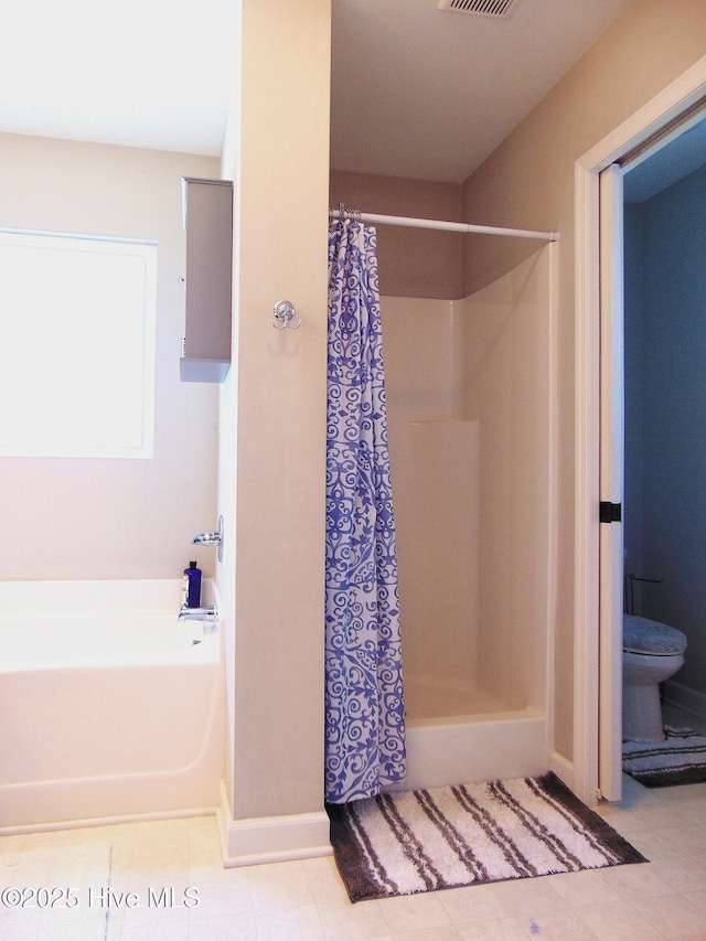 205 Brice Ct, Hubert, NC 28539 - full bathroom with toilet, a shower stall, a bath, and tile patterned floors