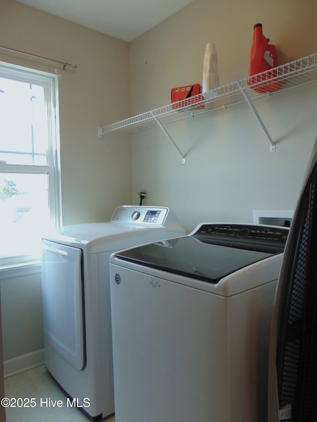 205 Brice Ct, Hubert, NC 28539 - laundry area featuring washer and dryer, plenty of natural light, and baseboards