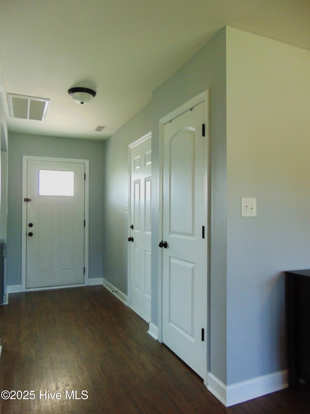 205 Brice Ct, Hubert, NC 28539 - entrance foyer with dark wood-style floors and baseboards