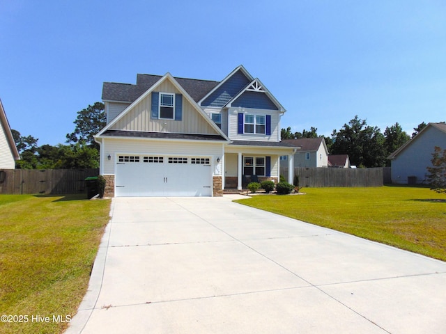 205 Brice Ct, Hubert, NC 28539 - craftsman house featuring board and batten siding, concrete driveway, a porch, stone siding, and an attached garage