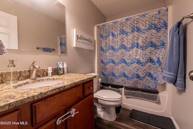 306 Top Knot Rd, Hubert, NC 28539 - full bath with vanity, wood finished floors, toilet, and shower / bath combo with shower curtain