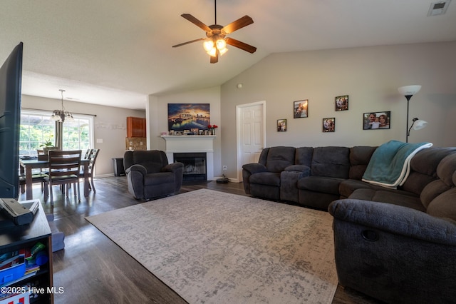 306 Top Knot Rd, Hubert, NC 28539 - living area with ceiling fan, dark wood-style floors, vaulted ceiling, a glass covered fireplace, and baseboards