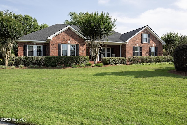 4301 Gainesford Ct, Wilmington, NC 28412 - view of front of home featuring brick siding, a front yard, and roof with shingles