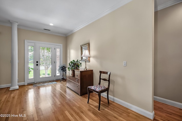 4301 Gainesford Ct, Wilmington, NC 28412 - entrance foyer featuring ornate columns, ornamental molding, light wood-type flooring, baseboards, and recessed lighting