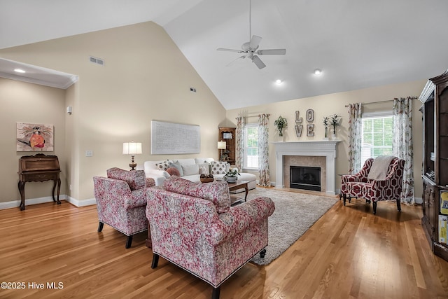 4301 Gainesford Ct, Wilmington, NC 28412 - living room with high vaulted ceiling, ceiling fan, light wood-style flooring, plenty of natural light, and a fireplace