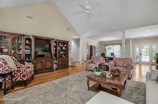 4301 Gainesford Ct, Wilmington, NC 28412 - living area featuring decorative columns, wood finished floors, a ceiling fan, high vaulted ceiling, and a chandelier