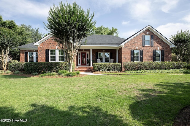 4301 Gainesford Ct, Wilmington, NC 28412 - view of front of house with brick siding and a front lawn