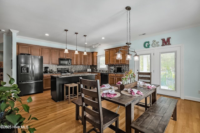 4301 Gainesford Ct, Wilmington, NC 28412 - dining space featuring ornamental molding, light wood-type flooring, and recessed lighting