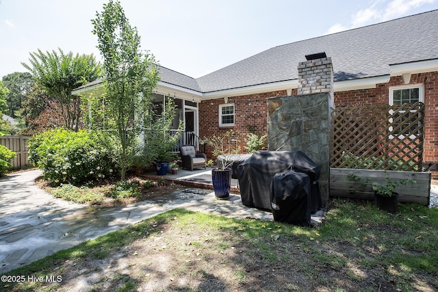 4301 Gainesford Ct, Wilmington, NC 28412 - back of property with brick siding, roof with shingles, and a patio