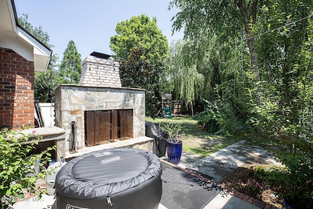 4301 Gainesford Ct, Wilmington, NC 28412 - view of patio / terrace with an outdoor stone fireplace