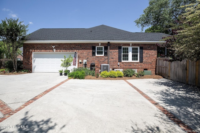 4301 Gainesford Ct, Wilmington, NC 28412 - view of front of home featuring driveway, brick siding, central AC, roof with shingles, and a garage