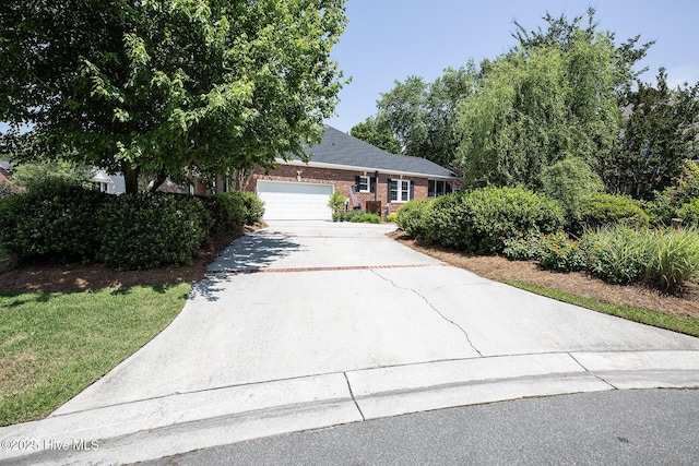 4301 Gainesford Ct, Wilmington, NC 28412 - view of front facade featuring concrete driveway, a garage, and brick siding