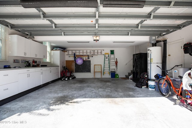 4301 Gainesford Ct, Wilmington, NC 28412 - garage featuring electric water heater, a garage door opener, and refrigerator