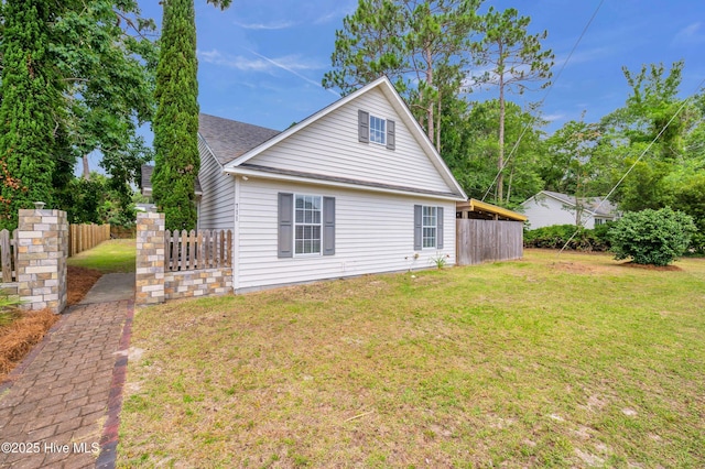 711 Navaho Trl, Wilmington, NC 28409 - rear view of property with a shingled roof