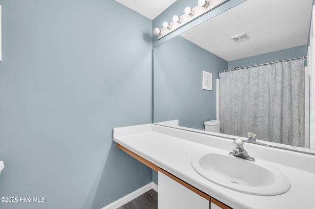 711 Navaho Trl, Wilmington, NC 28409 - full bath with vanity and wood finished floors