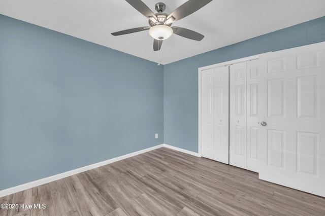 711 Navaho Trl, Wilmington, NC 28409 - unfurnished bedroom with wood finished floors, a closet, and ceiling fan