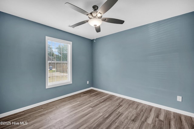 711 Navaho Trl, Wilmington, NC 28409 - unfurnished room featuring wood finished floors and a ceiling fan