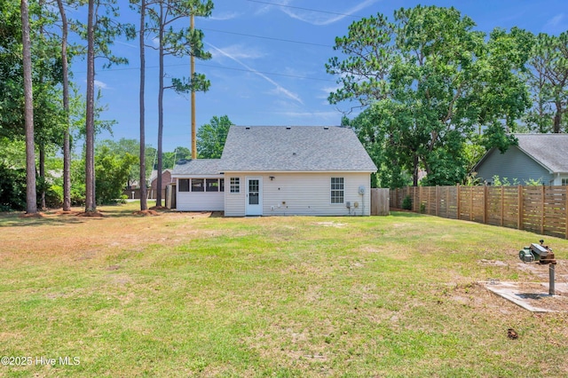 711 Navaho Trl, Wilmington, NC 28409 - rear view of house with a sunroom and roof with shingles