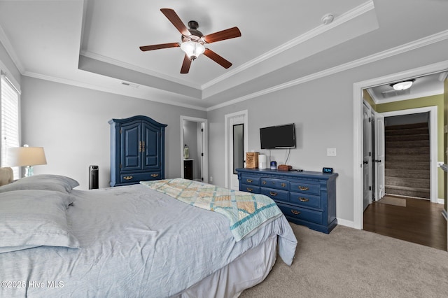 1763 Oak Pointe Dr, Greenville, NC 27834 - carpeted bedroom with a raised ceiling, crown molding, a ceiling fan, and baseboards
