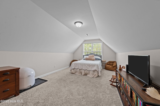 1763 Oak Pointe Dr, Greenville, NC 27834 - carpeted bedroom featuring vaulted ceiling and baseboards