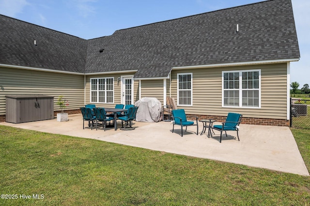 1763 Oak Pointe Dr, Greenville, NC 27834 - back of property with a patio area, roof with shingles, and a hot tub