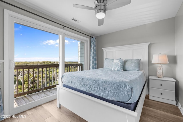 535 Salter Path Rd Unit 3, Pine Knoll Shores, NC 28512 - bedroom featuring wood finished floors, access to exterior, and a ceiling fan