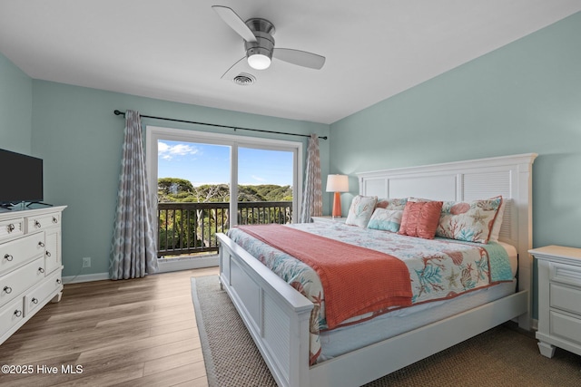 535 Salter Path Rd Unit 3, Pine Knoll Shores, NC 28512 - bedroom featuring access to exterior, wood finished floors, a ceiling fan, and baseboards