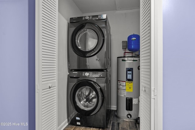 535 Salter Path Rd Unit 3, Pine Knoll Shores, NC 28512 - laundry area featuring water heater, stacked washer / dryer, and wood finished floors